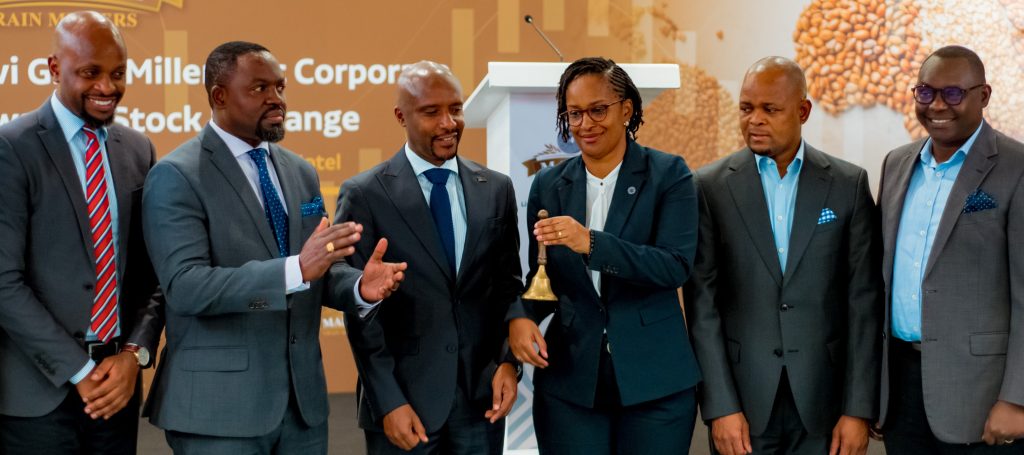 Business and capital markets leaders in Rwanda watch Mahwi Grain Millers chairperson ring the bell for listing the corporate bond for trading on the Rwanda Stock Exchange after raising capital.