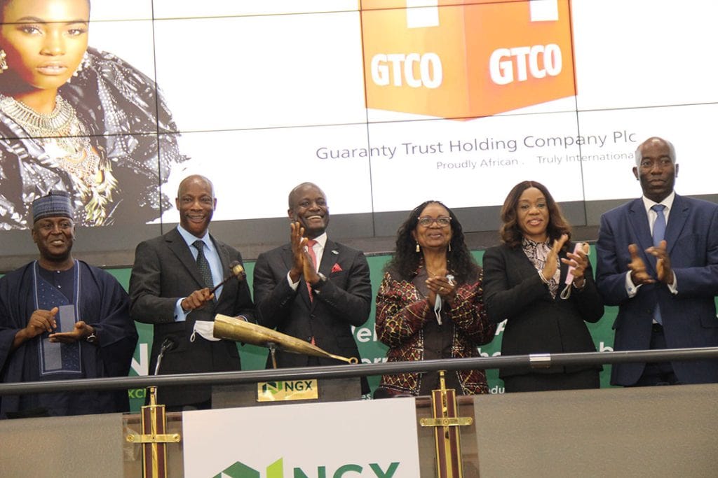 Executives and leaders of Nigeria's Guaranty Trust Holding Co celebrate the June 2021 listing on the Nigerian Exchange (NGX)