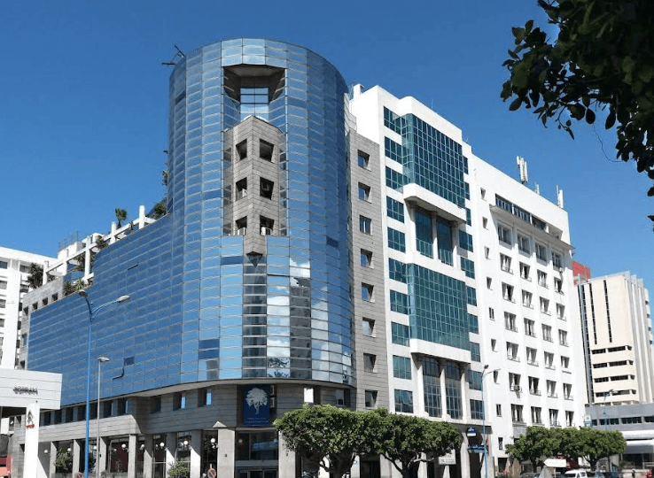 Big modern building on street in Casablanca, Morocco. The headquarters of the Casablanca Stock exchange.