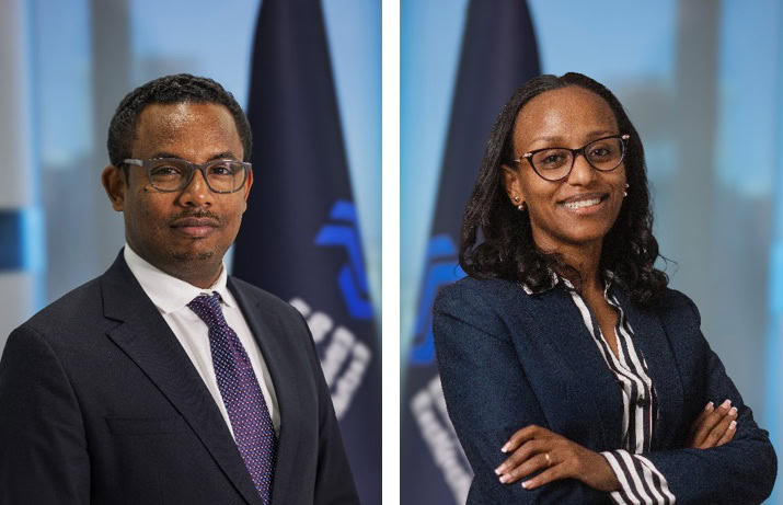 A man and a woman in formal business attire, the previous and new CEO of ESX.
